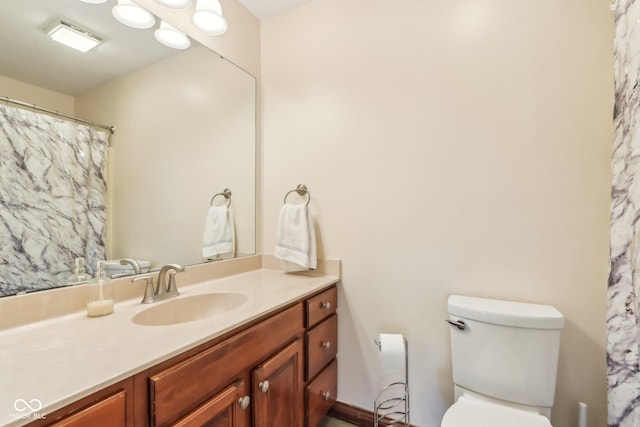 full bathroom featuring toilet and vanity