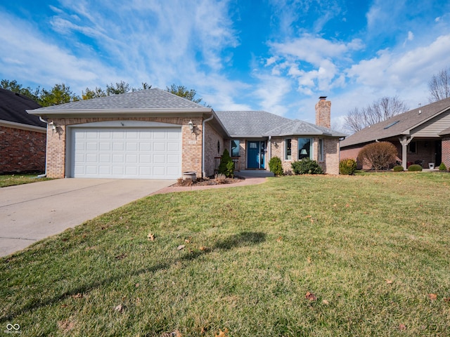 ranch-style house featuring concrete driveway, a chimney, an attached garage, a front yard, and brick siding