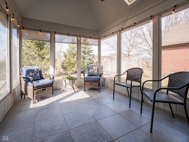 sunroom featuring vaulted ceiling