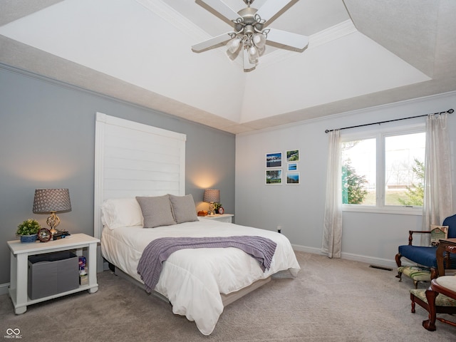 bedroom featuring visible vents, baseboards, ornamental molding, a tray ceiling, and carpet