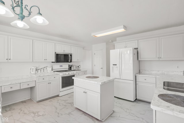 kitchen featuring a sink, white appliances, marble finish floor, and white cabinets