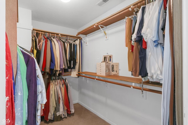 spacious closet featuring visible vents and carpet