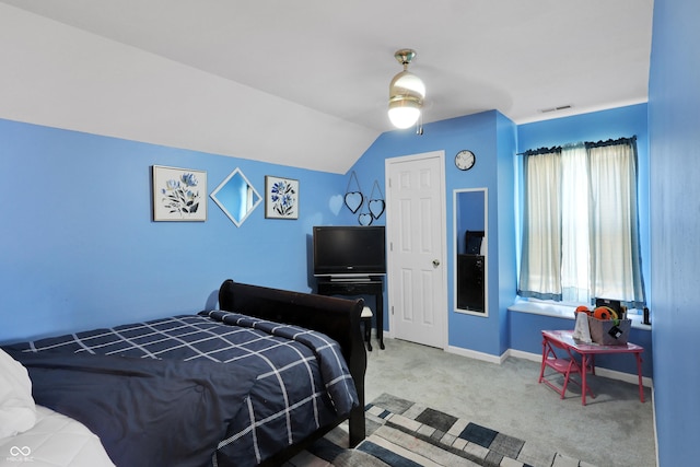 bedroom with a ceiling fan, baseboards, visible vents, lofted ceiling, and carpet flooring