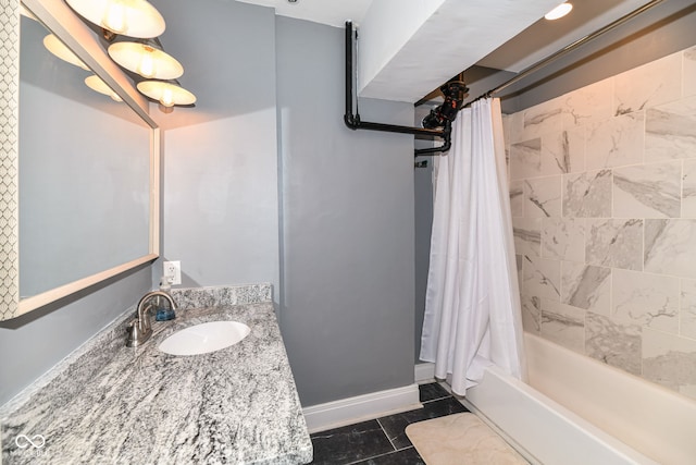 bathroom featuring shower / bath combo, vanity, and baseboards