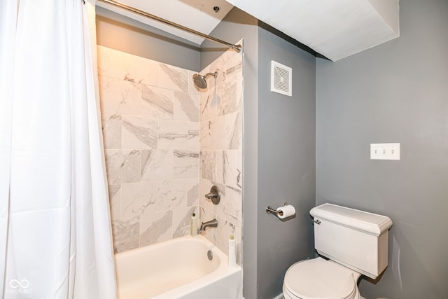 bathroom featuring toilet, shower / tub combo, and visible vents