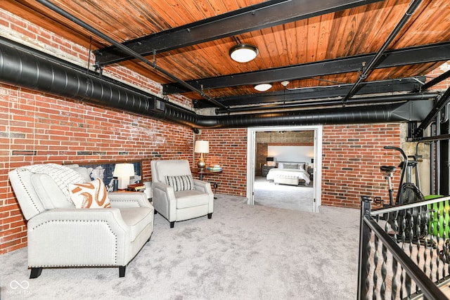 unfurnished room featuring carpet and brick wall