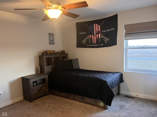 bedroom featuring a ceiling fan, carpet flooring, visible vents, and baseboards