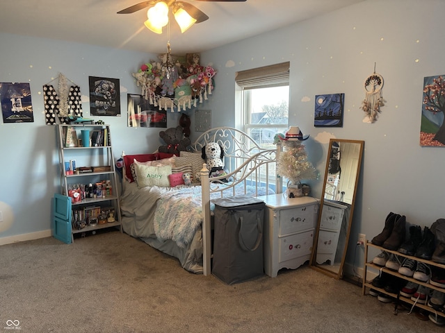 bedroom with carpet flooring, a ceiling fan, and baseboards