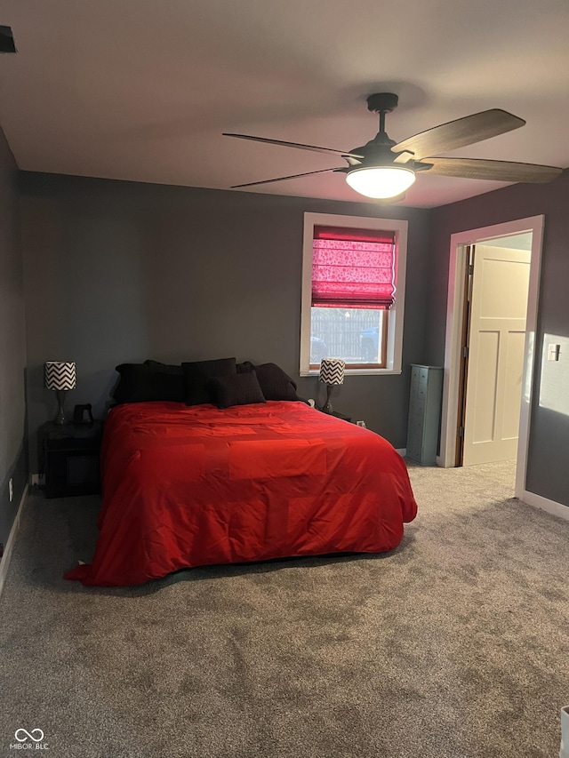 bedroom with a ceiling fan and carpet flooring