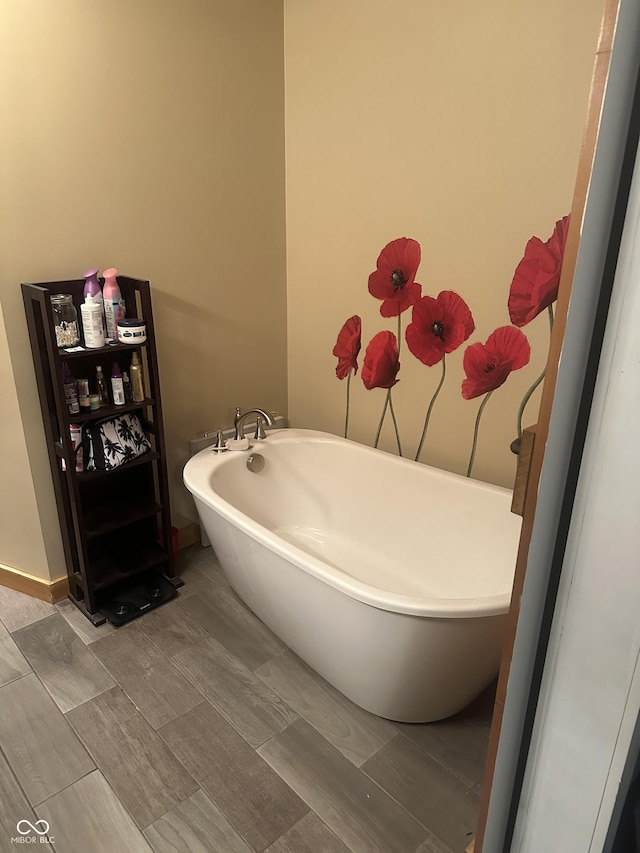 bathroom with a freestanding tub