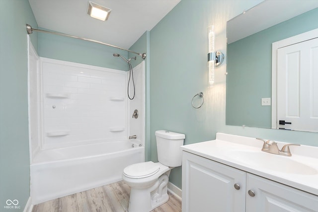 full bathroom featuring shower / bathtub combination, vanity, toilet, and wood finished floors