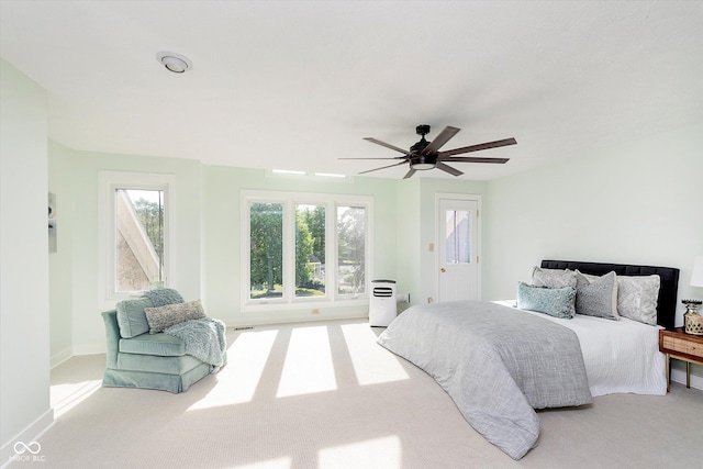 bedroom featuring carpet, baseboards, and ceiling fan