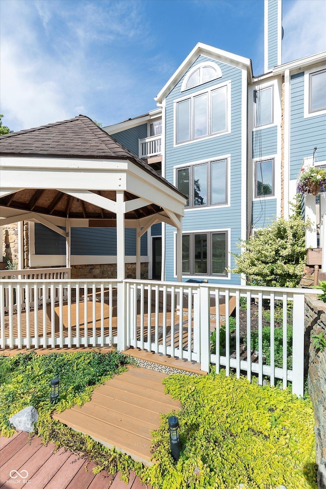 exterior space with a shingled roof