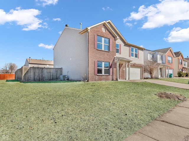 view of front of home with an attached garage, brick siding, fence, concrete driveway, and a front lawn