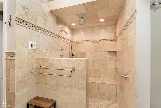 full bath featuring a tile shower