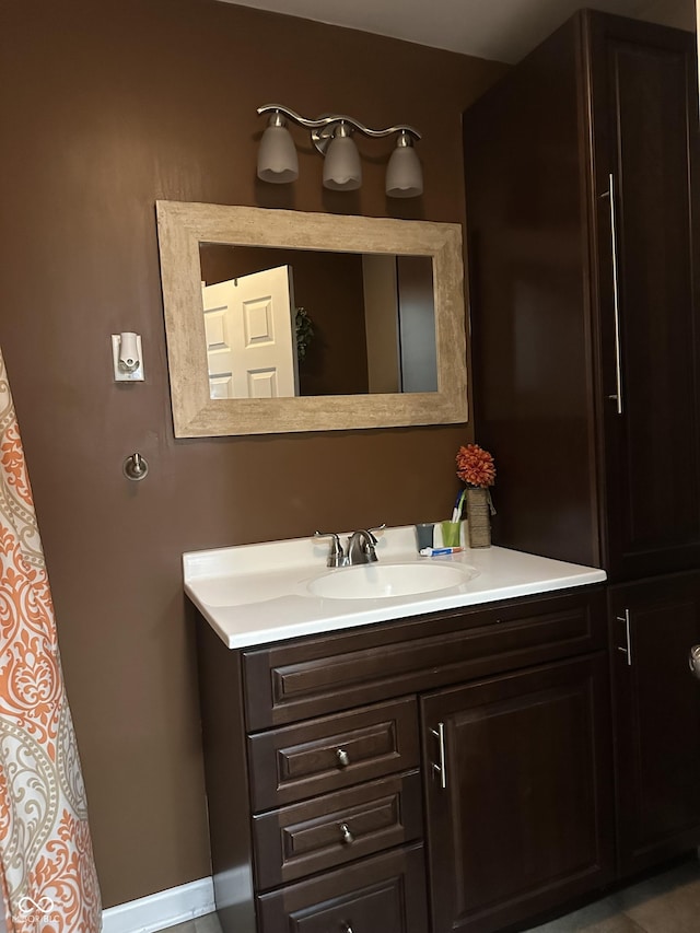 bathroom featuring vanity and baseboards