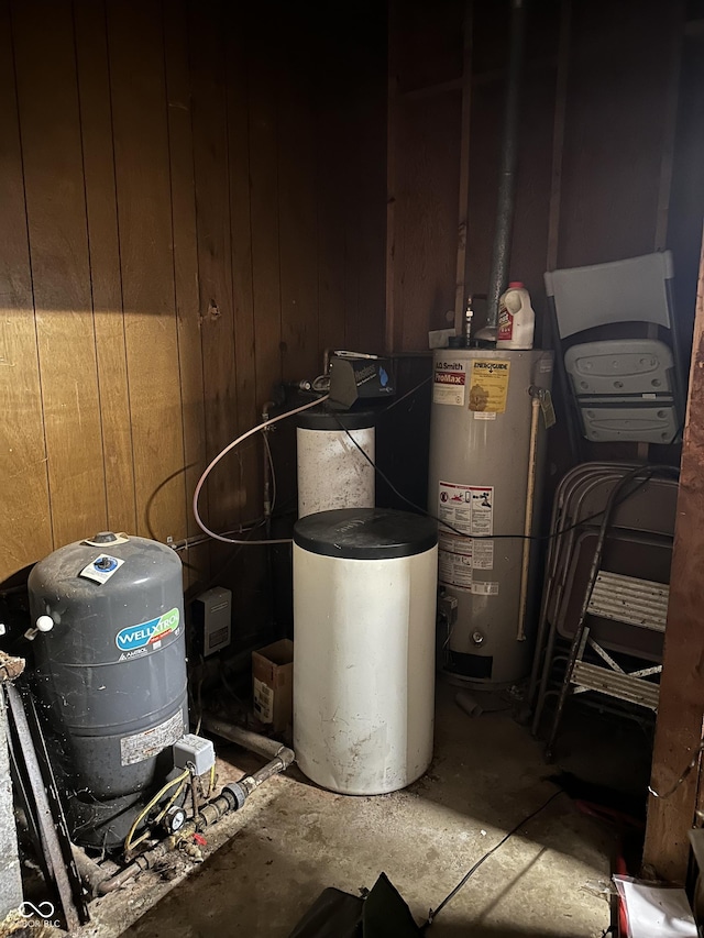 utility room featuring water heater