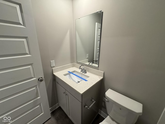 half bath with toilet and vanity