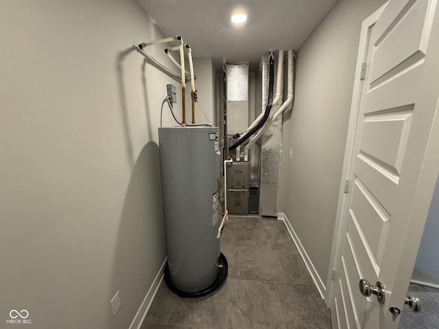 utility room with electric water heater