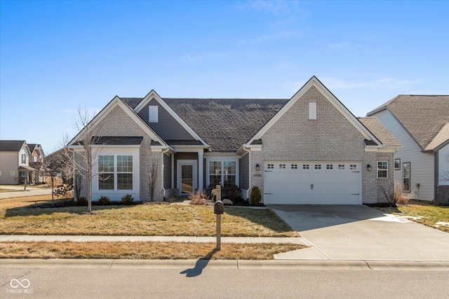 view of front facade with driveway, an attached garage, a front yard, and brick siding