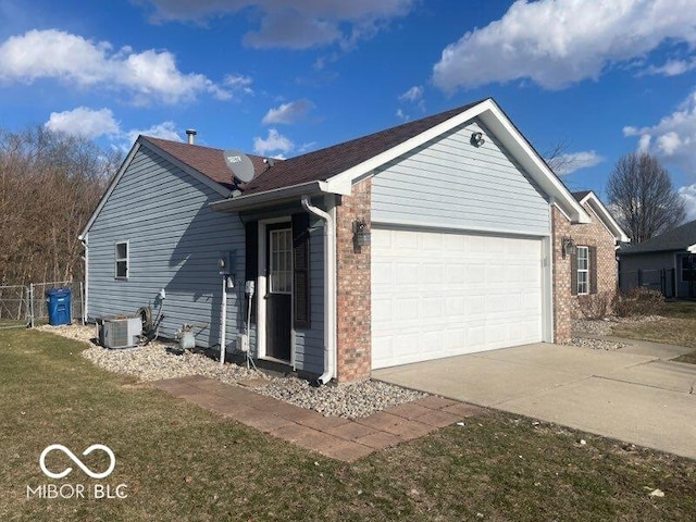 view of front of house with brick siding, central air condition unit, concrete driveway, fence, and a garage