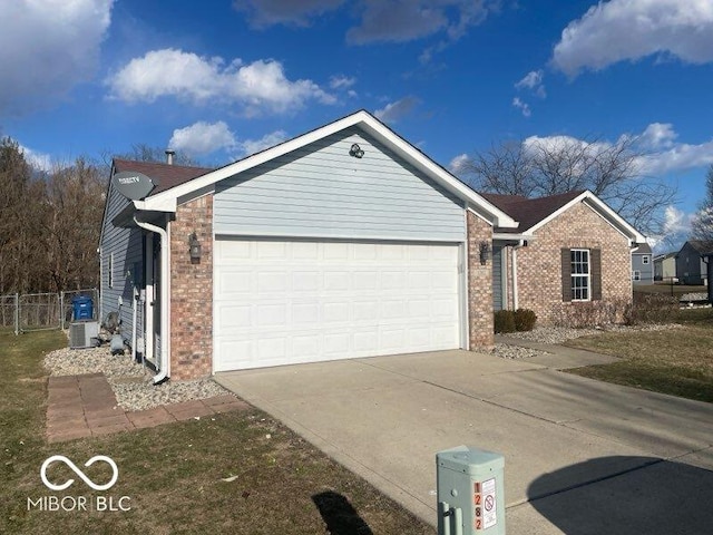 view of front of property featuring central AC unit, a garage, brick siding, fence, and concrete driveway