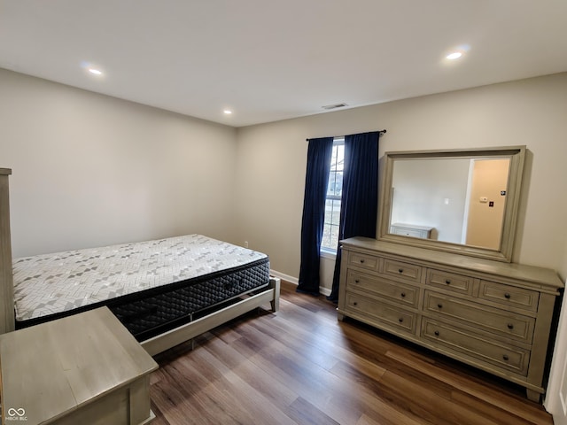 bedroom featuring baseboards, visible vents, dark wood-style flooring, and recessed lighting