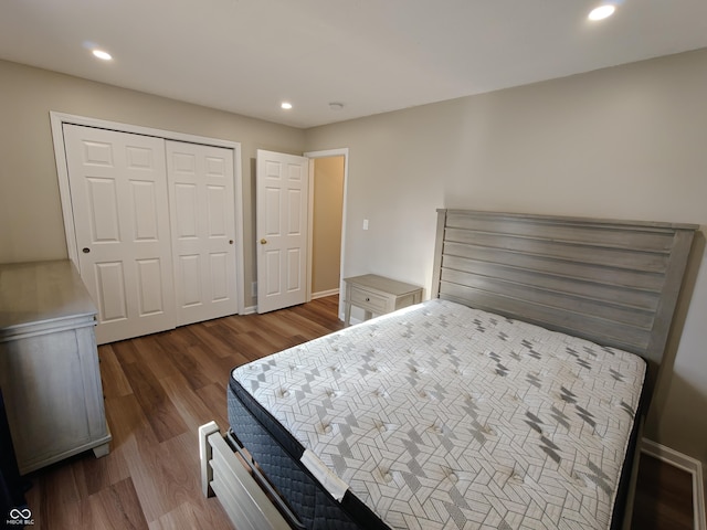 bedroom with a closet, wood finished floors, and recessed lighting