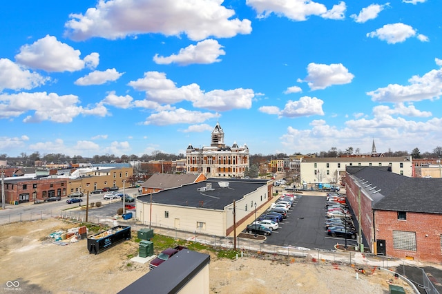 birds eye view of property with a city view