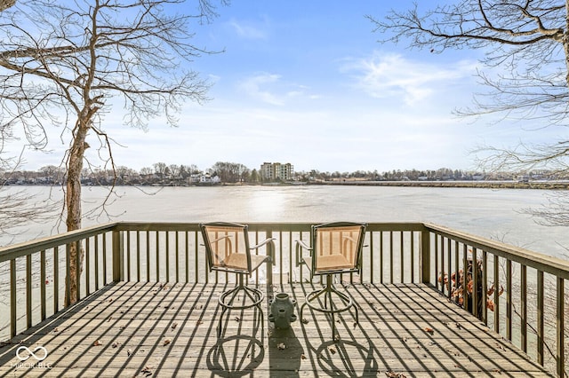 wooden deck with a water view