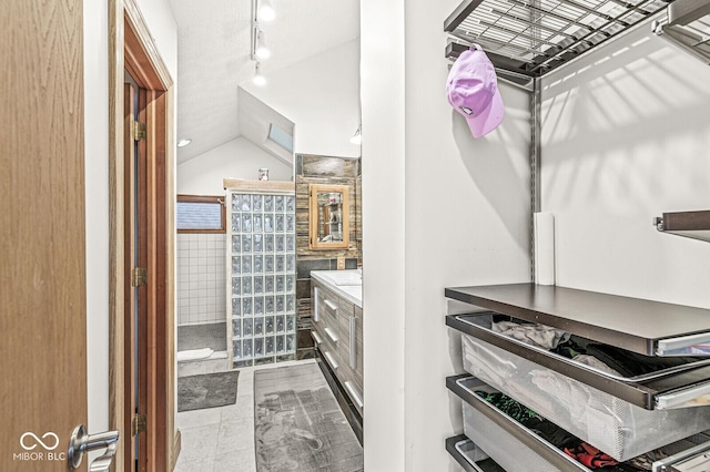 spacious closet with vaulted ceiling