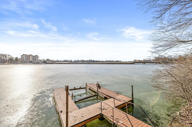 view of dock with a water view and boat lift