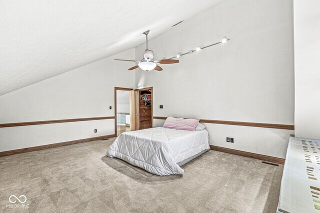 bedroom featuring a textured ceiling, baseboards, and carpet flooring