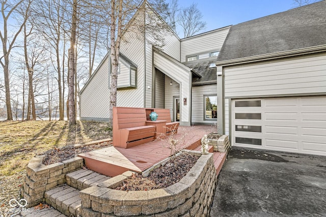 view of patio with a garage and driveway