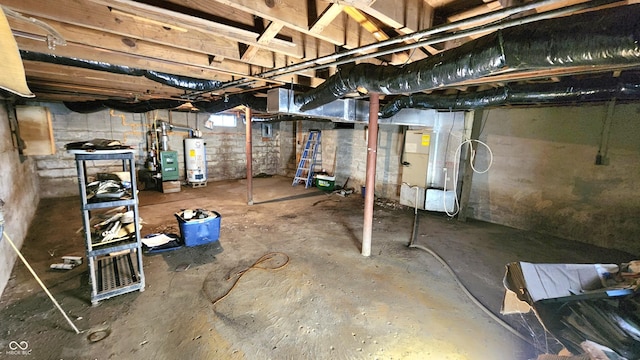 unfinished basement with gas water heater and heating unit