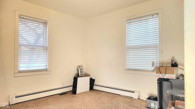 interior space with a healthy amount of sunlight and a baseboard radiator