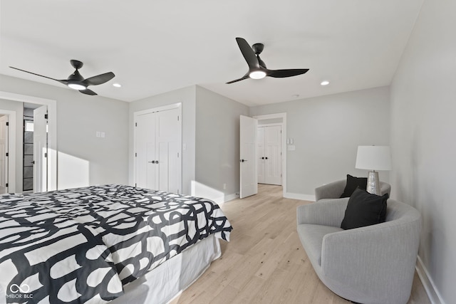 bedroom featuring recessed lighting, light wood-type flooring, a ceiling fan, and baseboards