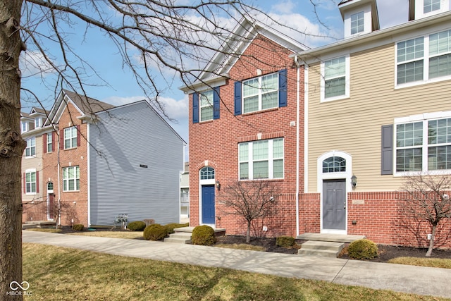 view of front of home with brick siding