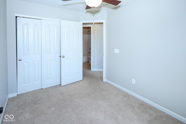 unfurnished bedroom with a ceiling fan, carpet, baseboards, and a closet