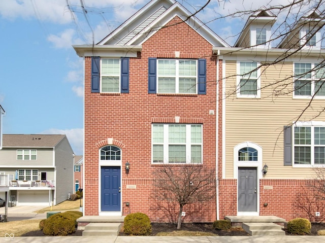 view of front of house featuring brick siding