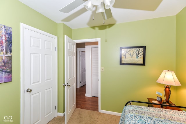 bedroom featuring carpet, baseboards, and ceiling fan