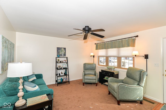 living area featuring visible vents, carpet, a ceiling fan, and baseboards