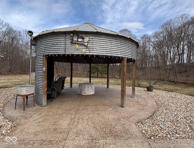 exterior space with a carport and a gazebo