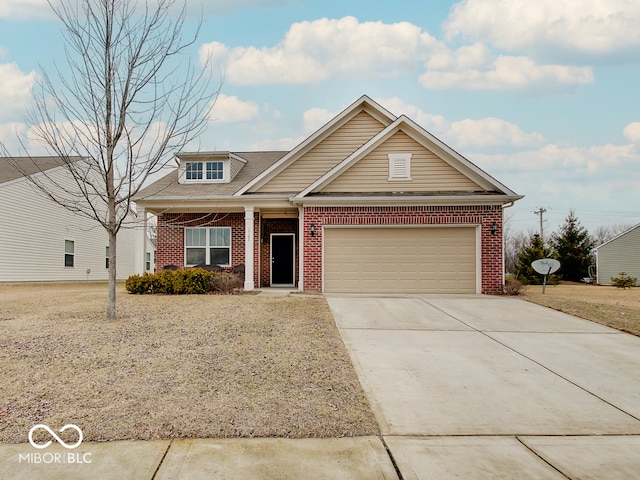 view of front of property featuring a garage, driveway, and brick siding