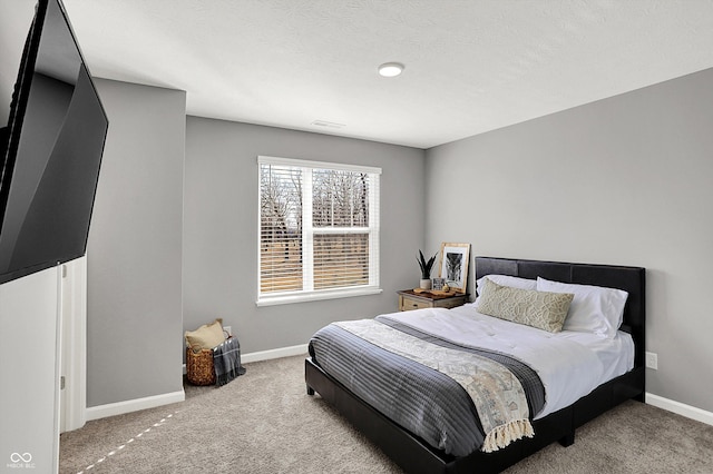 bedroom featuring visible vents, carpet, and baseboards