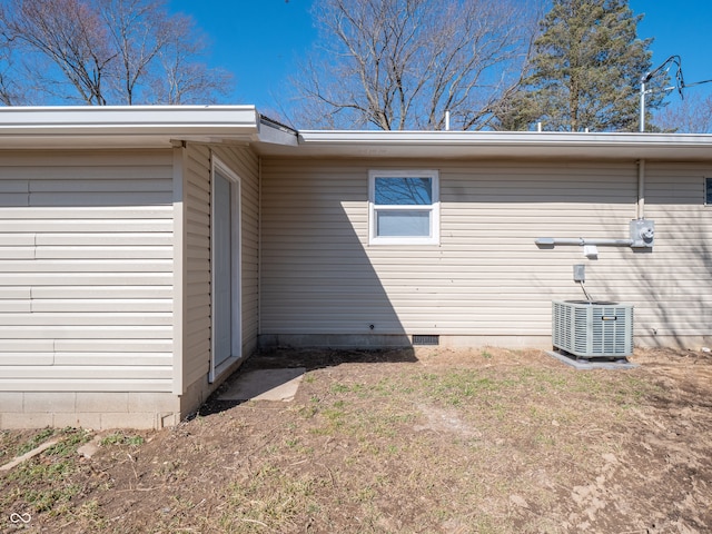 exterior space with central AC and crawl space