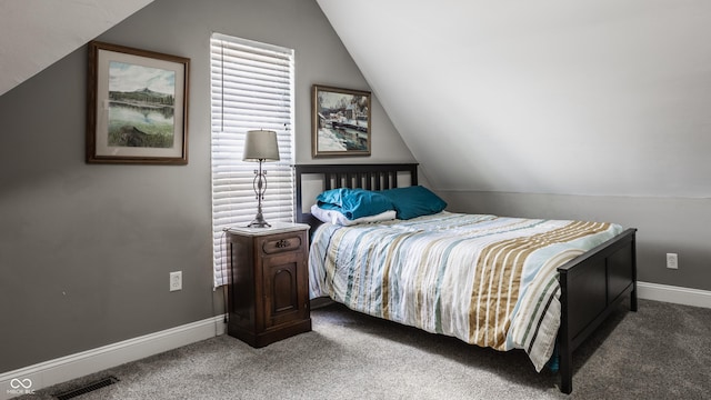 carpeted bedroom with lofted ceiling, visible vents, and baseboards