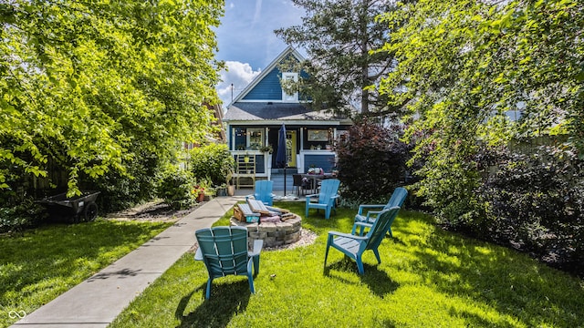 view of front of house with a front yard and a fire pit