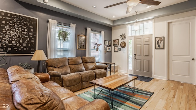 living area with ceiling fan, hardwood / wood-style floors, recessed lighting, and baseboards