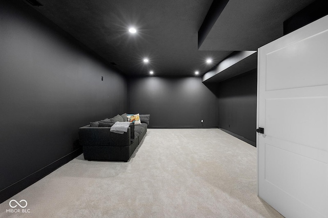 home theater room with carpet floors, recessed lighting, and baseboards